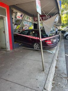 Car crashes into front window of Monbulk butcher