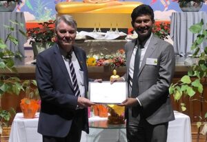 Frank Carter honoured for Buddhist education work